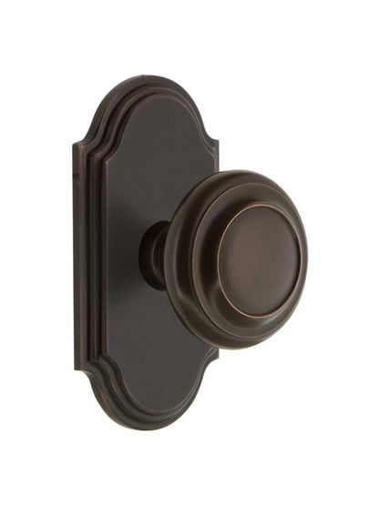 Grandeur Arc Rosette Door Set with Circulaire Knobs in Timeless Bronze.
